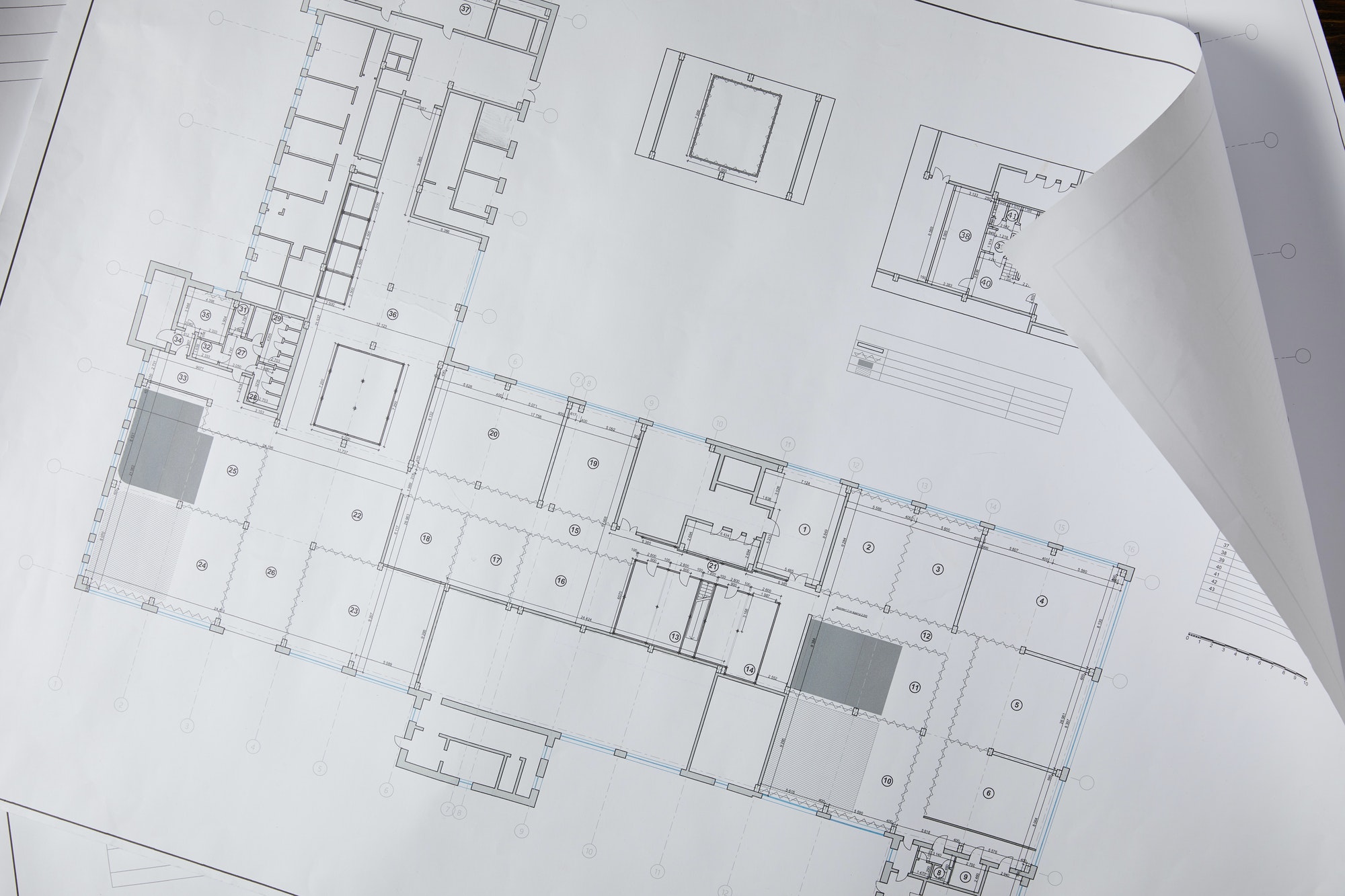 view-from-above-of-architectural-blueprint-on-white-paper.jpg